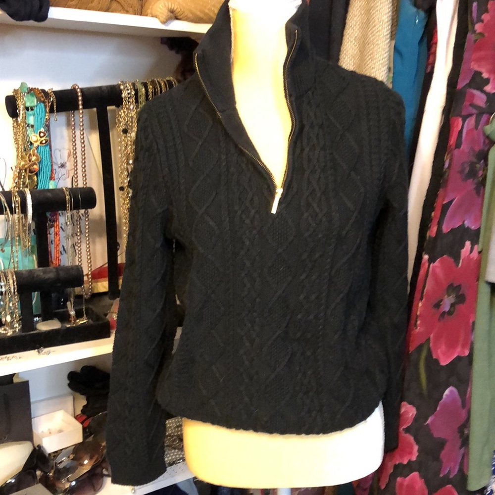 Black sweater with gold zipper